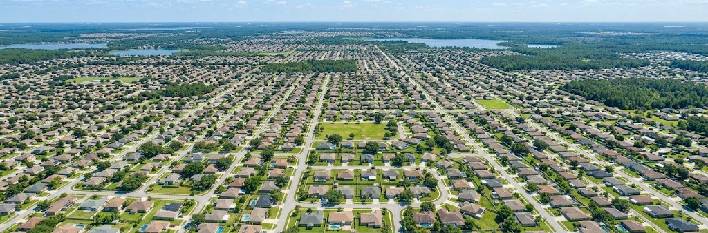 Aerial view of single-family homes in an Osceola County subdivision, stretching to the horizon.